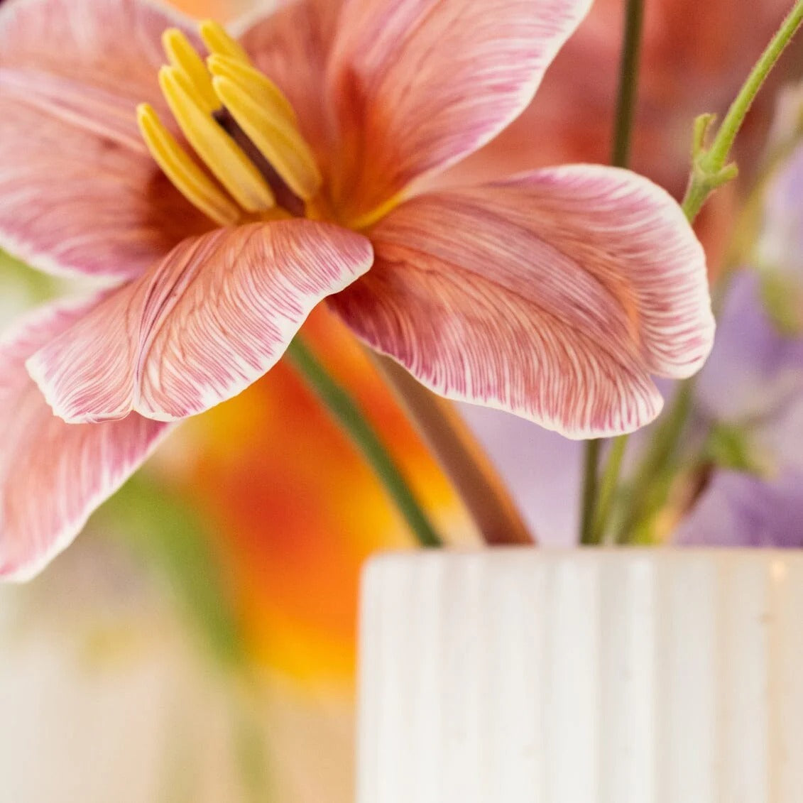 Grace in Bloom handcrafted ceramic vase holding a single flower, adding serenity and elegance to home decor